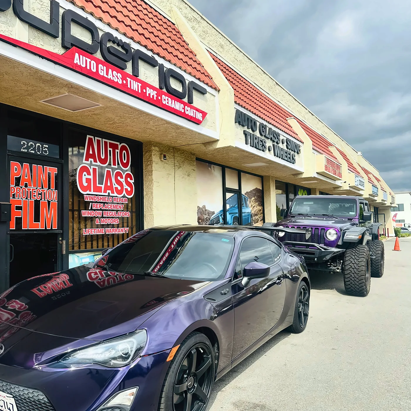 Vehicles parked outside the Superior shop