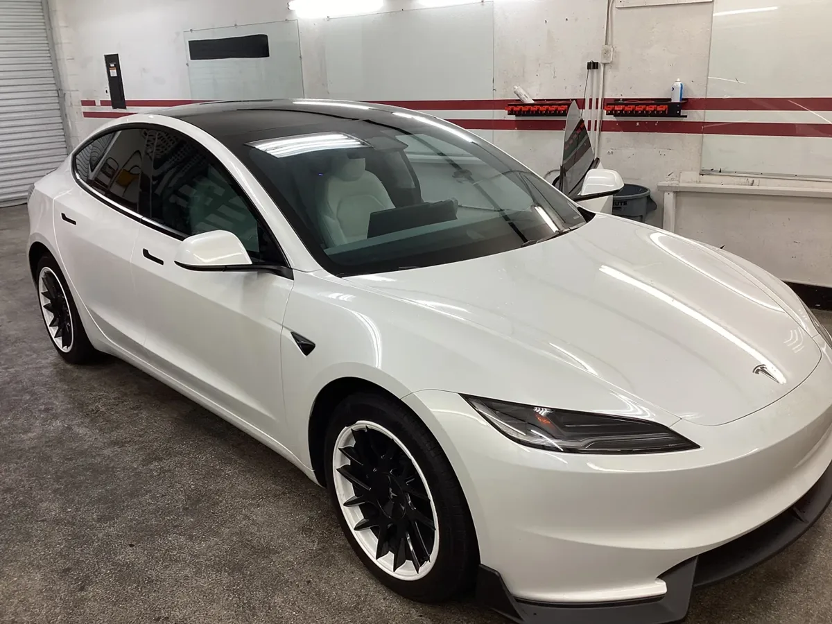 White Tesla with tinted windows outside Superior’s Ontario shop