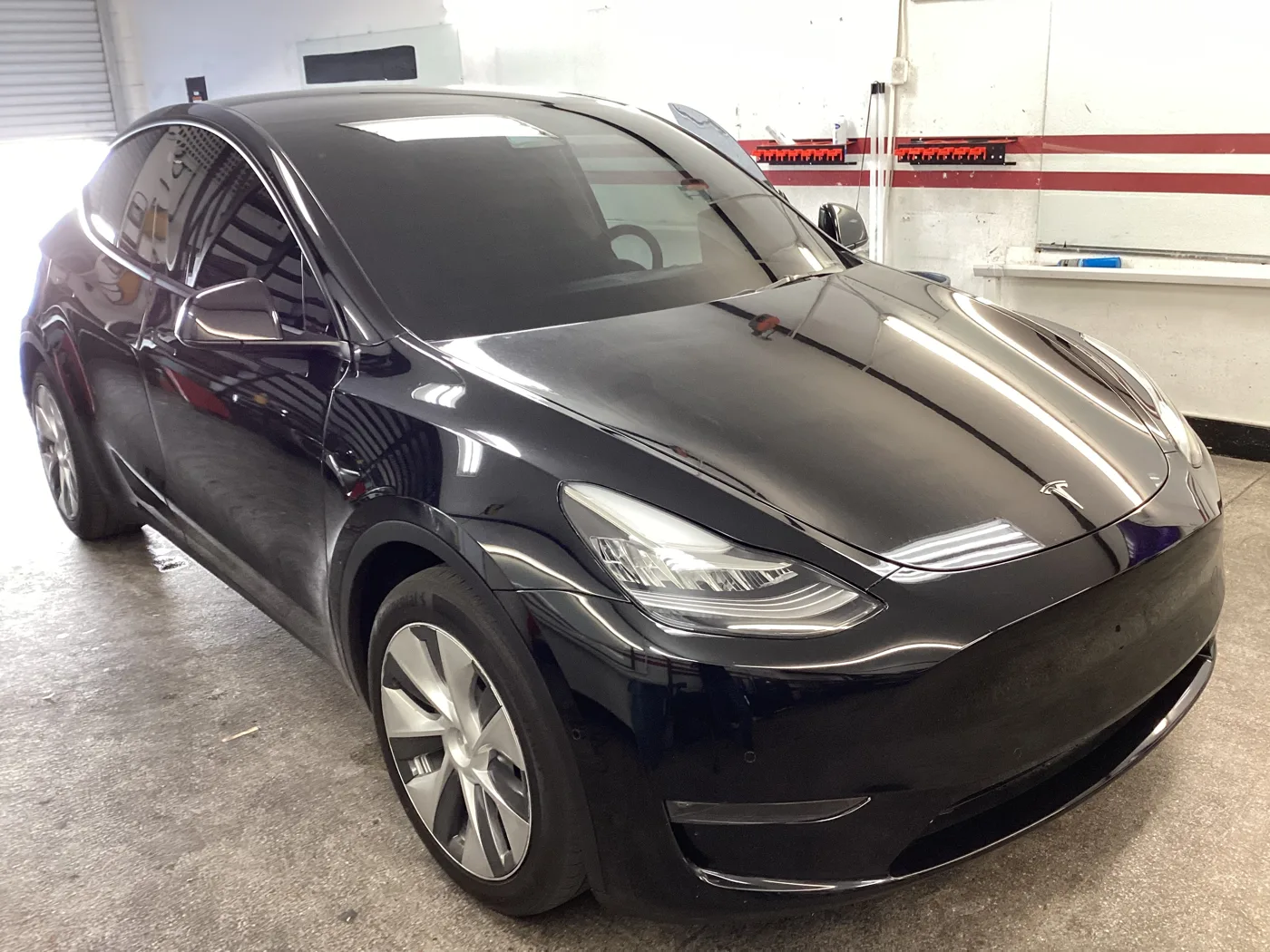 Dark Tesla Model Y from Superior’s window tint photo collection in Ontario