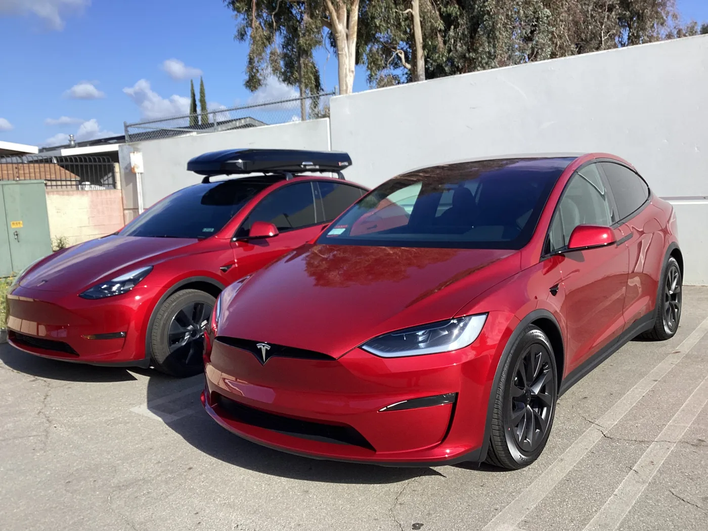 Red Tesla vehicles outside the shop from Superior’s window tint photo collection in Ontario